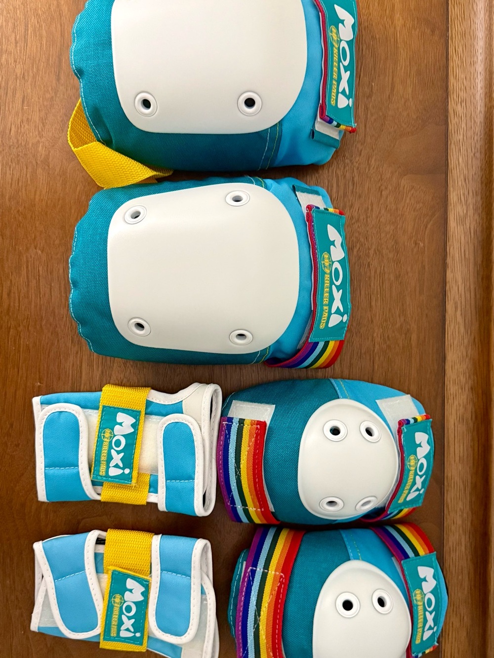 Moxi Roller Skates Teal Wrist, Elbow, and Knee Pad Set with Rainbow Accents - Picture 3 of 4